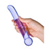 Hand holding a purple glass G-spot tickler wand with a curved tip and rounded bulbous handle.