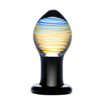 Handcrafted Glas Galileo glass butt plug with blue and yellow swirl design and black base on white background.