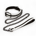 Black and white bondage collar with matching leash featuring a black metal chain and buckle on a white background.