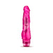 Pink translucent realistic vibrator with textured shaft and twist dial base for multi-speed control.