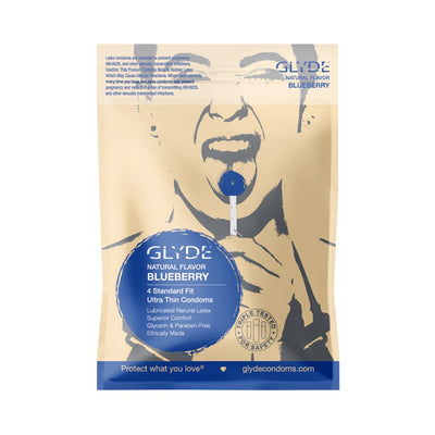 Glyde Ultra Natural Flavor Blueberry condoms 4-pack in beige packaging with blue lollipop graphic and product details.