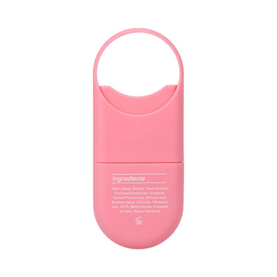 Compact pink travel-sized Goodhead Juicy Head dry mouth spray with loop handle and ingredient list on back.