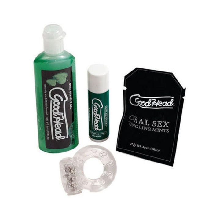 Goodhead Kit for Him with mint-flavored gel, lip balm, oral sex tingling mints, and clear vibrating ring on white background.