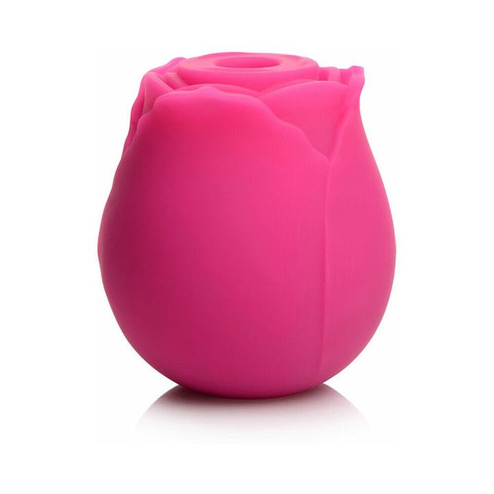 Pink rose-shaped clitoral vibrator made of soft silicone with a discreet compact design.