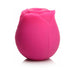 Pink rose-shaped clitoral vibrator made of soft silicone with a discreet compact design.