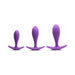 Set of three violet silicone plugs in small, medium, and large sizes with curved bases for comfort and control.