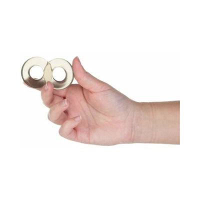 Hand holding two translucent smoke-colored stretchy cock rings connected in a figure-eight shape.