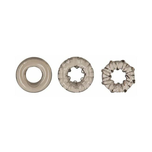 Three smoky translucent cock rings in varying textures and shapes displayed on a white background.