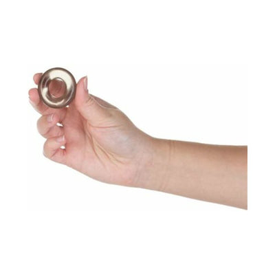 Hand holding a translucent smoky-colored stretchy cock ring from the Got Big Dick 3-pack set against a white background.