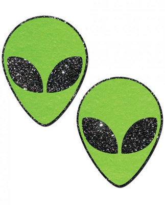 Pair of green glitter alien face-shaped pasties with black glitter eyes on white background