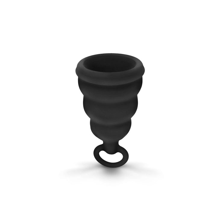 Black Gvibe Gcup menstrual cup with bell shape and pull tab on white background