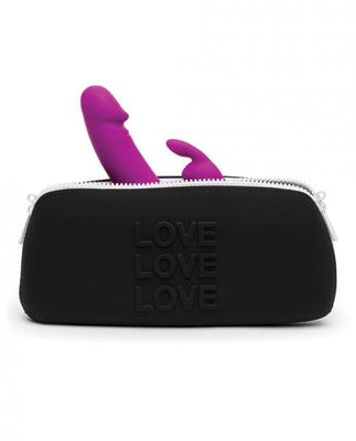 Black silicone storage bag with embossed LOVE text and partially visible purple silicone toy inside, zippered closure.