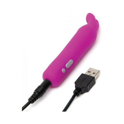 Purple rechargeable bullet vibrator with flexible bunny ears and USB charging cable on white background.