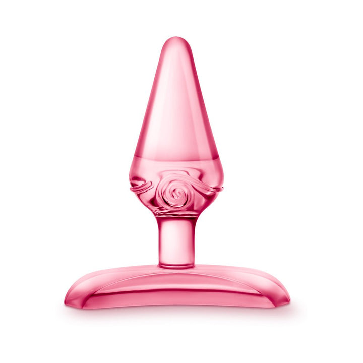 Purple tapered beginner-friendly anal plug with decorative swirl and wide base for safe use.