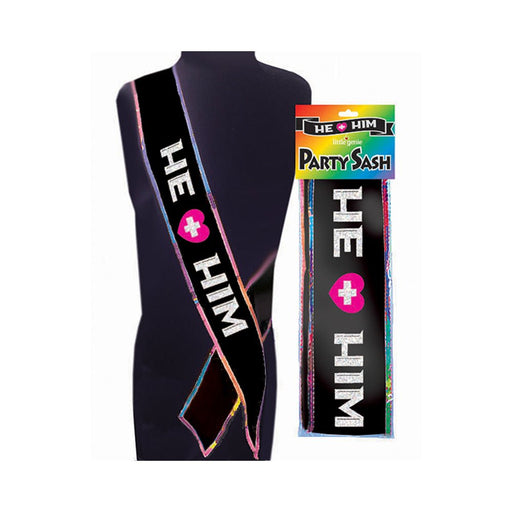 Black party sash with "HE + HIM" text and pink heart, edged with rainbow trim, displayed on mannequin and in packaging.