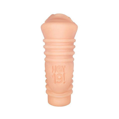 Compact flesh-toned stroker with textured grip and embossed Hey 19! logo on a white background.