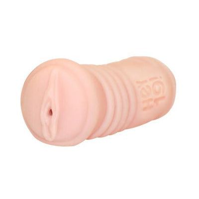 Compact flesh-toned stroker with textured grip and realistic design detail on a white background.