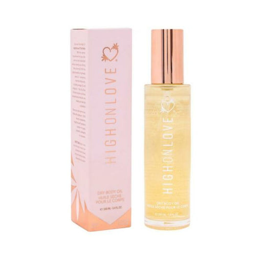 Highonlove Dry Body Oil Spray bottle with rose gold cap next to pink and orange branded packaging box.