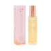 Highonlove Dry Body Oil Spray bottle with rose gold cap next to pink and orange branded packaging box.