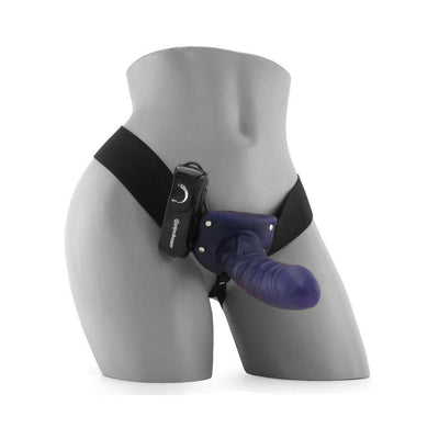 Mannequin wearing a purple hollow strap-on with adjustable black straps and attached remote control.