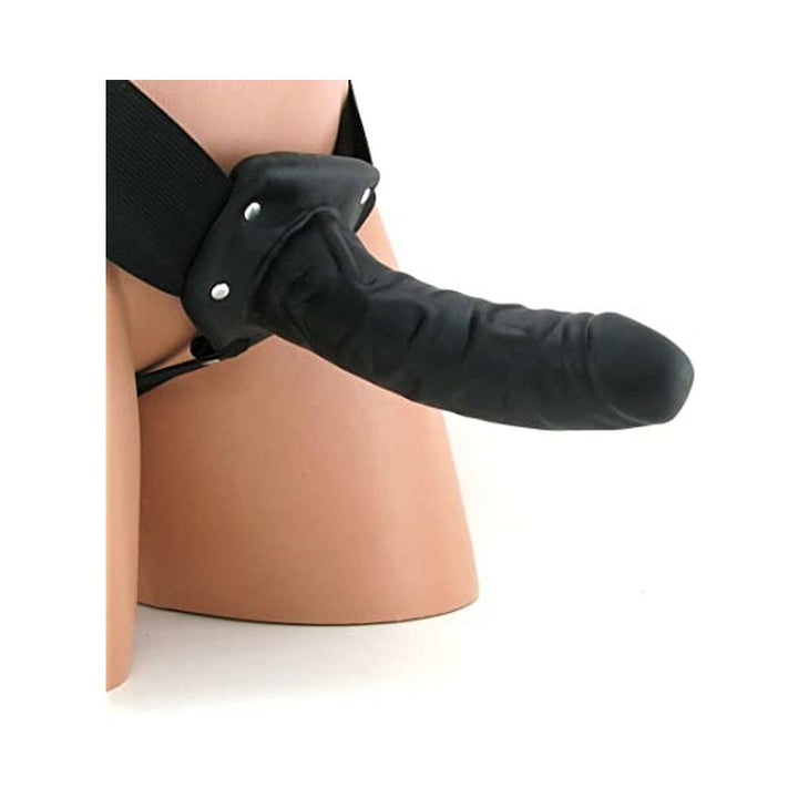 Black hollow strap-on with adjustable waistband displayed on mannequin hips against white background.