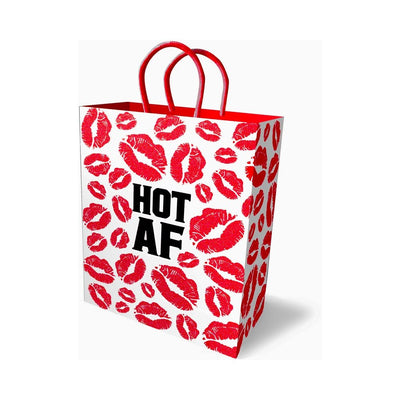White gift bag with red lip prints and bold black "HOT AF" text, featuring red handles.