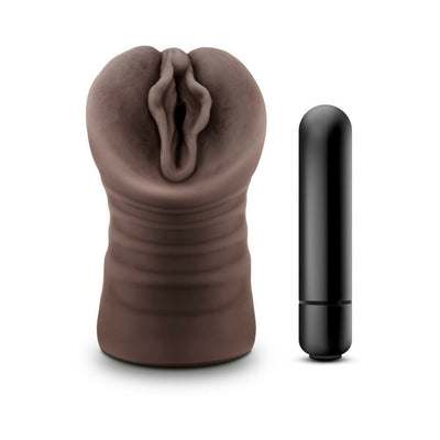 Chocolate-colored realistic textured male masturbator with a black vibrating bullet beside it on a white background.