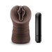 Chocolate-colored realistic textured male masturbator with a black vibrating bullet beside it on a white background.