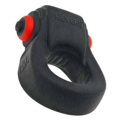 Black rubbery cockring with integrated red bullet vibrator and textured grip, labeled REVERB on top.