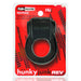 Black rubbery cockring with bullet vibrator in red and black Hunkyjunk packaging labeled Revring Plus+ Silicone blend.