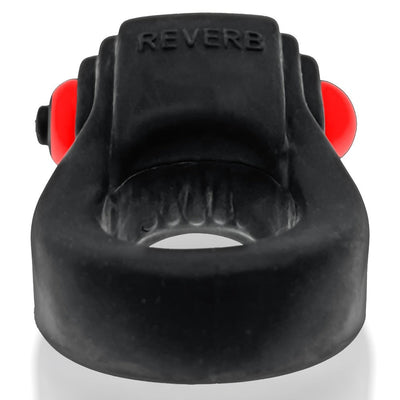 Black rubbery cockring with integrated red bullet vibrator and textured inner grip, front view showing REVERB branding.