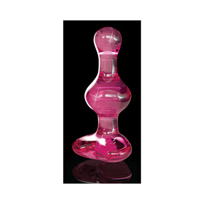 Pink hand-blown glass wand with smooth curves and a flared base on a reflective black surface