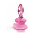 Pink glass anal plug with tapered tip and flexible silicone suction cup base for secure placement and versatile use.