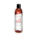 120ml bottle of Intimate Earth Wild Strawberries flavored oral pleasure glide with black cap and strawberry-themed label.