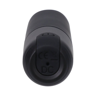 Compact black bullet vibrator shown from the charging port end with smooth silicone finish.