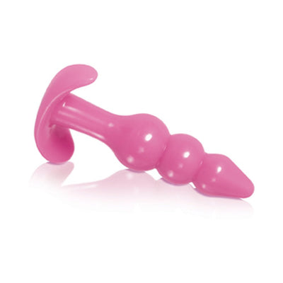 Pink tapered anal plug with graduated beads and a flared base for safe use.