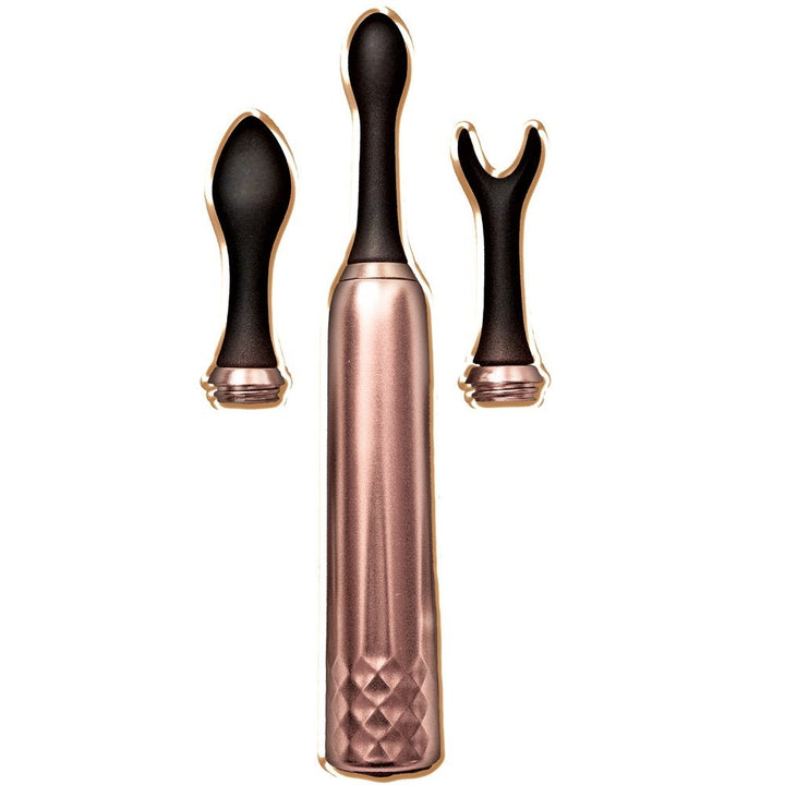 Rose gold multi-function massager with three interchangeable black silicone attachment heads on white background.