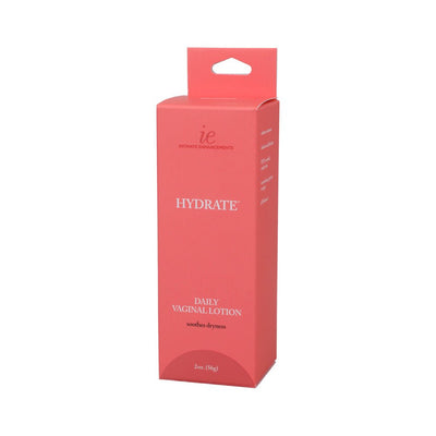 Coral pink box of Intimate Enhancements Hydrate Daily Vaginal Lotion 2oz with white text and product details.