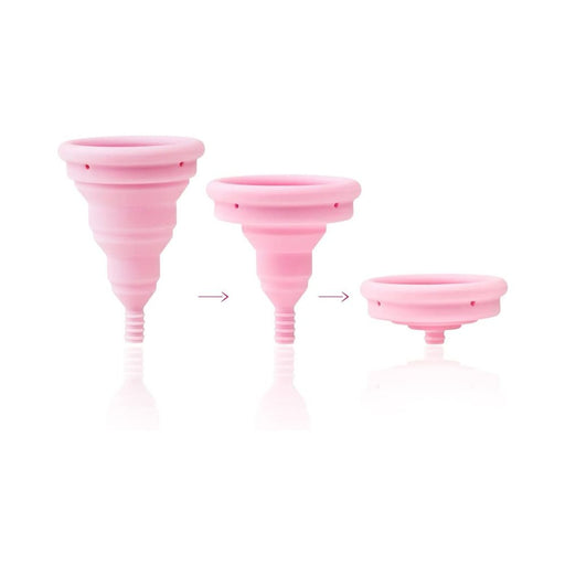 Pink Intimina Lily Cup Compact menstrual cup shown in three stages of collapsing for easy storage.