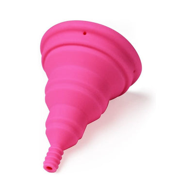 Pink Intimina Lily Cup Size B menstrual cup made of flexible medical-grade silicone with a tapered stem.