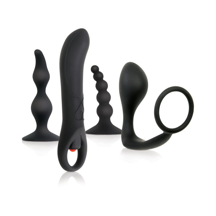 Four-piece black prostate stimulation kit with varied silicone toys including beads, bulb, vibrator, and ring.