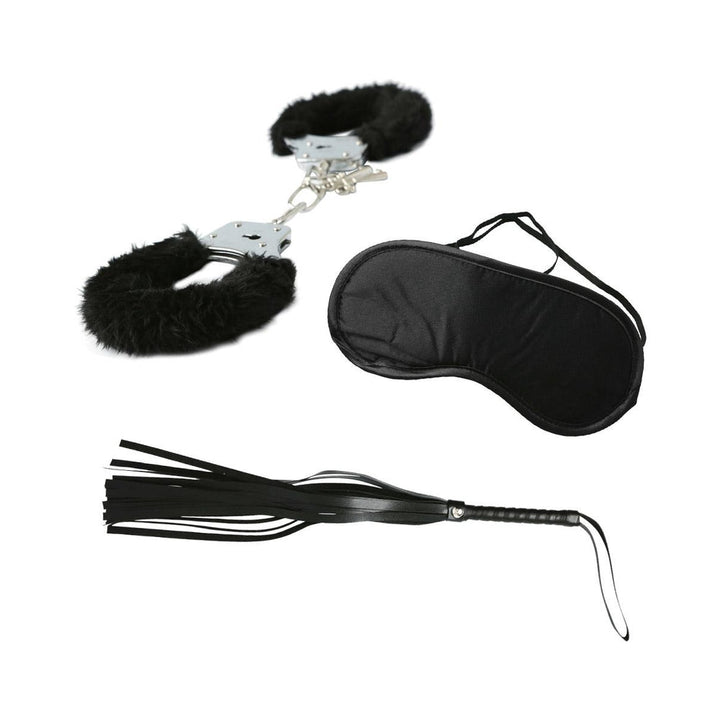 Black furry handcuffs, satin blindfold, and black leather whip included in beginner S&M kit on white background.