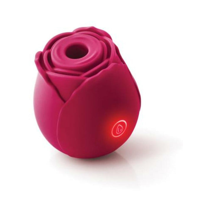 Compact deep pink rose-shaped silicone device with illuminated power button, designed for targeted air stimulation.