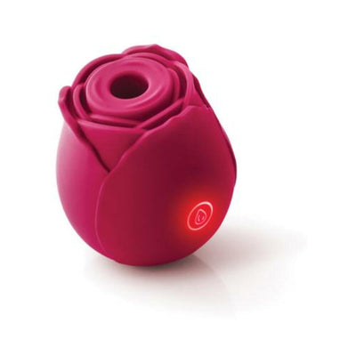 Compact deep pink rose-shaped silicone device with illuminated power button, designed for targeted air stimulation.