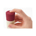 Hand holding the Iroha Rin Akane Massager by Tenga, focusing on the red cap with embossed branding.