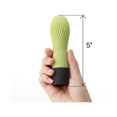Hand holding a 5-inch green tea colored Iroha Zen mini vibrator with textured silicone surface and black base.