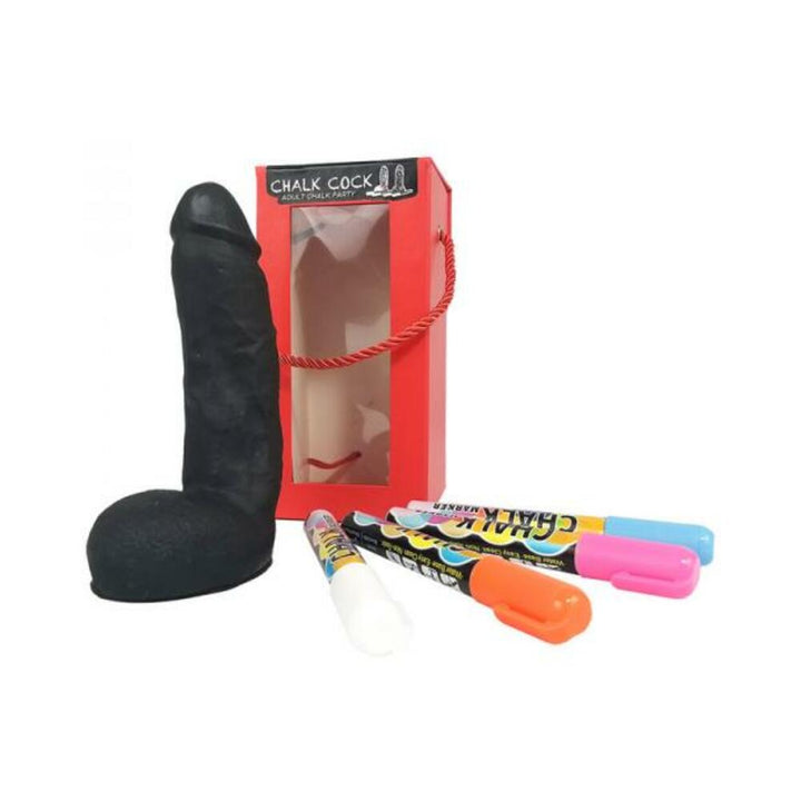 Black chalkboard shaped like a phallic symbol with colorful chalk markers and red gift box packaging.