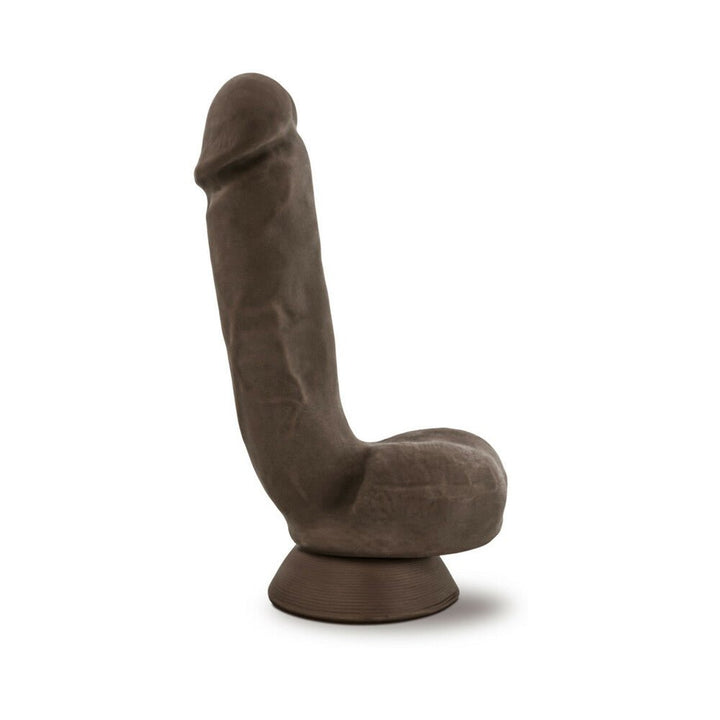 Realistic brown dildo with suction cup base and lifelike texture standing upright on a white background.