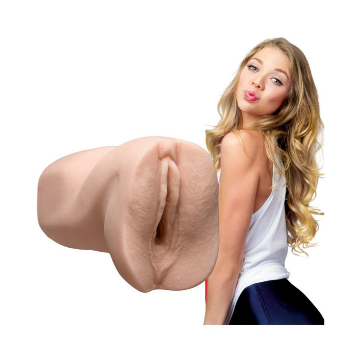 Realistic skin-toned masturbator with lifelike texture next to a blonde woman in a white tank top and dark pants.