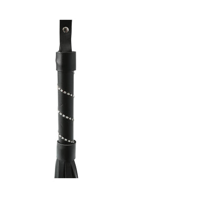 Close-up of black flogger handle wrapped with a spiral of small clear jewels and attached wrist strap.